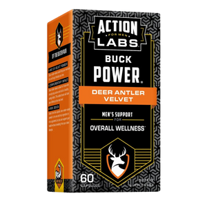 A box of Action Labs Buck Power Deer Antler Velvet dietary supplement capsules, featuring a black and orange design with a geometric pattern.
