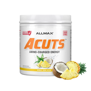 A white plastic tub of ALLMAX Acuts Amino-Charged Energy supplement in Pina Colada flavor, featuring pineapple and coconut graphics on the label, with a few loose pineapple slices and a coconut placed in front of the tub on a white background.