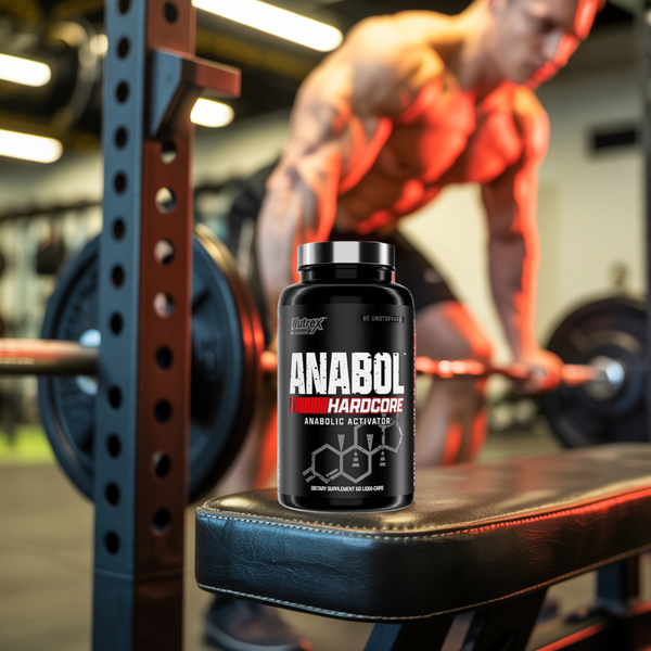 Anabol hardcore sitting on a bench at the gym with a man lifting weights in the background indicating a lifestyle image.