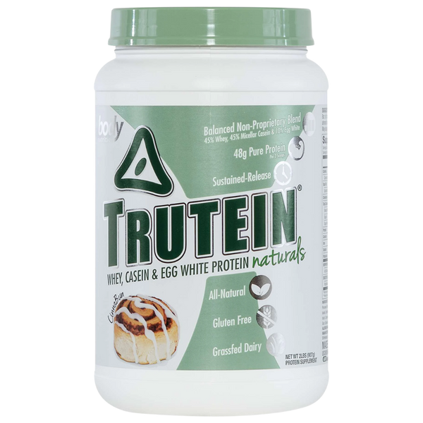 Trutein protein powder container with green lid on a white background