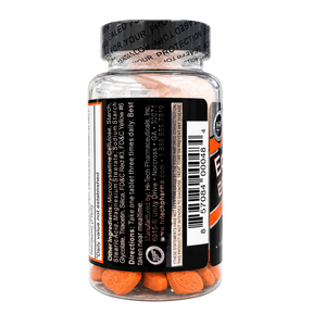 A clear supplement bottle with a black cap and black label, showing orange tablets inside. The label includes a barcode, product ingredients, directions, and a circular logo.