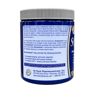 A blue bottle of Hi-Tech Pharmaceuticals Somatamax dietary supplement with a gray ribbed cap, shown from the back against a white background.