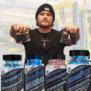 Man holding supplement bottles in a warehouse setting