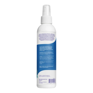 A white plastic spray bottle with a white pump dispenser, shown from the back. The bottle features a prominent blue label with white text detailing ingredients and product information.