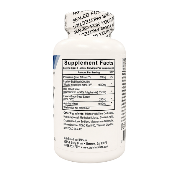 A white plastic bottle of dietary supplements shown from the back, displaying the Supplement Facts label. The label lists ingredients such as Potassium Bromo-Nitro, Inositol, and Red Wire Extract.