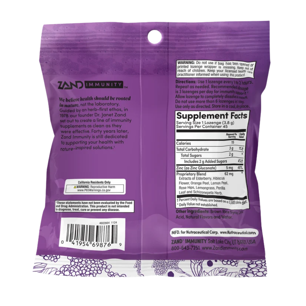 Zand Immunity Elderberry Zinc dietary supplement in a purple and white resealable pouch with berry illustrations and fruit imagery on the front.