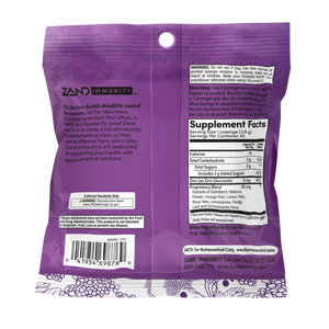 The back of a purple Zand Immunity herbal supplement pouch, showing the full ingredients list, warning label, and supplement facts on a white background.