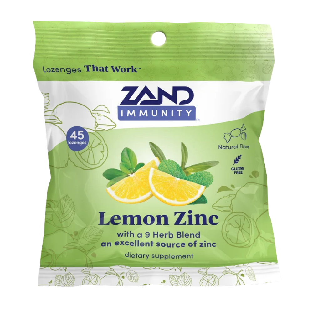 Zand Immunity Lemon Zinc lozenge packet, featuring a light green and white design with illustrations of lemons, limes, and mint leaves, containing 45 lozenges.