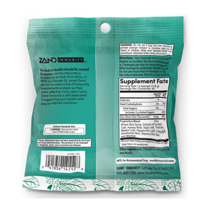The back of a teal Zand Immunity herbal supplement pouch, showing the product's text, a barcode, a nutrition facts label, and a white hanging hole at the top.