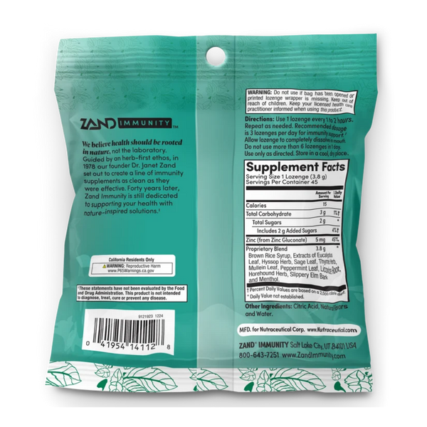 The back of a teal Zand Immunity herbal supplement pouch, showing the product's text, a barcode, a nutrition facts label, and a white hanging hole at the top.