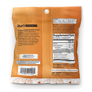 The back of a Zand Immunity herbal supplement bag, showing the product name, directions, a barcode, and supplement facts on an orange background with a subtle leaf pattern.