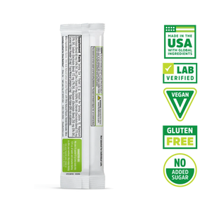 A single stick pack of Sweetener Free protein powder shown from the back, featuring a white wrapper with green and black text, alongside five green and white certification badges on the right.