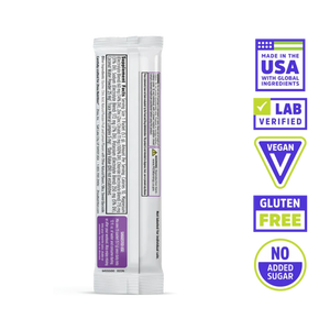 A single stick pack of Nutri-Grain Multigrain Cereal shown from the back on a white background, with five feature badges on the right: Made in the USA with Global Ingredients, Lab Verified, Vegan, Gluten Free, and No Added Sugar.