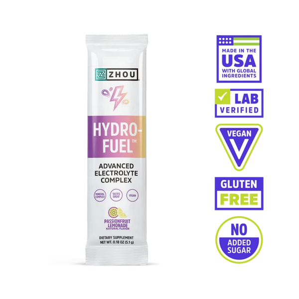A single stick pack of ZHOU Hydro-Fuel Advanced Electrolyte Complex on a white background, accompanied by five certification and feature badges on the right.
